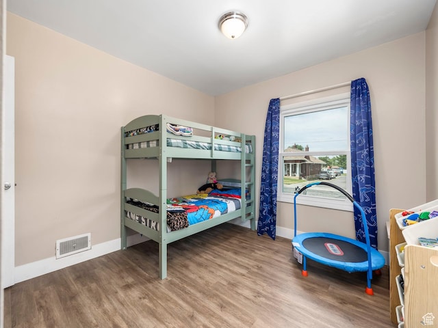 1116 S Liberty Ave, Ogden, UT 84404 - bedroom featuring baseboards and wood finished floors