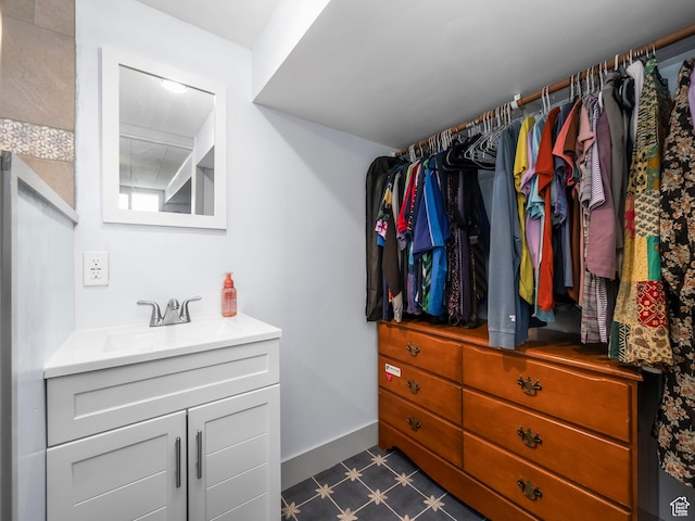 1116 S Liberty Ave, Ogden, UT 84404 - walk in closet featuring a sink and dark flooring