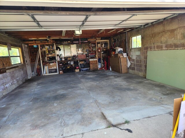 1116 S Liberty Ave, Ogden, UT 84404 - garage featuring concrete block wall and a garage door opener
