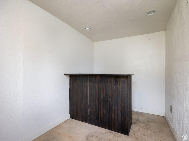 1116 S Liberty Ave, Ogden, UT 84404 - empty room featuring concrete flooring, recessed lighting, and a bar