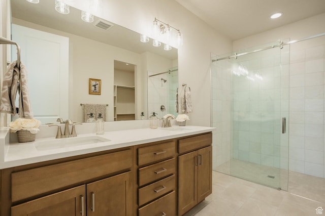 3 Rosalia Rdg, St George, UT 84770 - full bath featuring a stall shower, double vanity, a spacious closet, tile patterned flooring, and recessed lighting