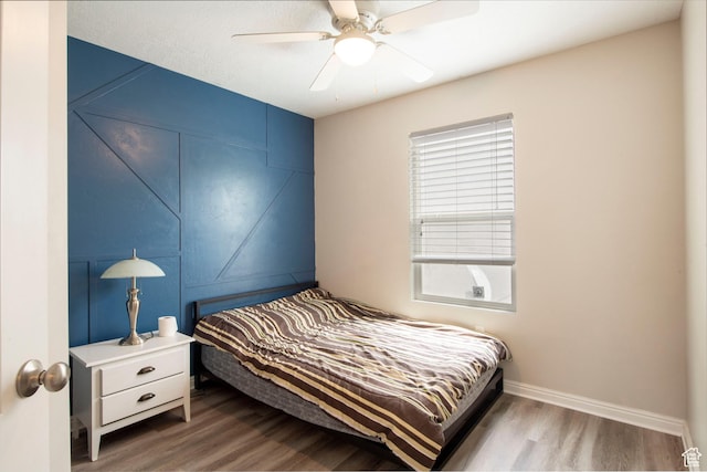 3408 S Carrick Dr W, South Salt Lake, UT 84115 - bedroom with wood finished floors, multiple windows, and ceiling fan