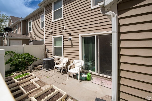 3408 S Carrick Dr W, South Salt Lake, UT 84115 - view of patio featuring a garden
