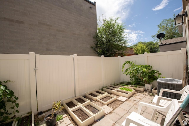 3408 S Carrick Dr W, South Salt Lake, UT 84115 - view of patio with a garden