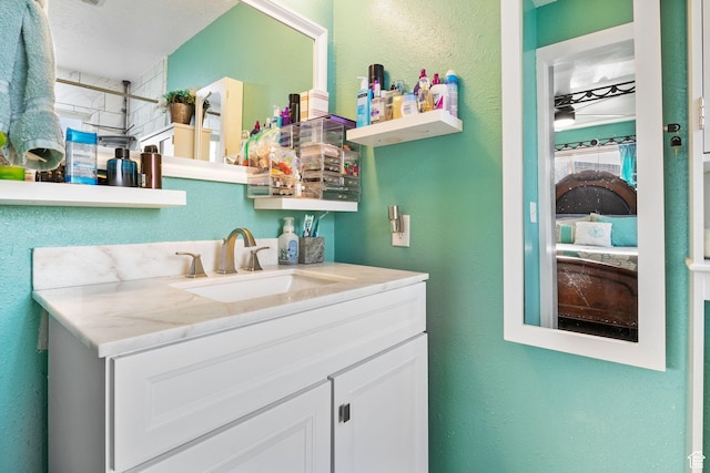 4895 W Pavant Ave, West Valley City, UT 84120 - bathroom with vanity and a textured wall
