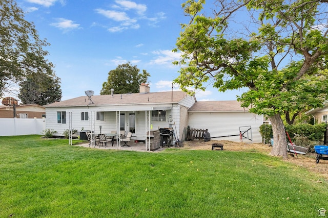 4895 W Pavant Ave, West Valley City, UT 84120 - rear view of house featuring a patio area, a chimney, and french doors