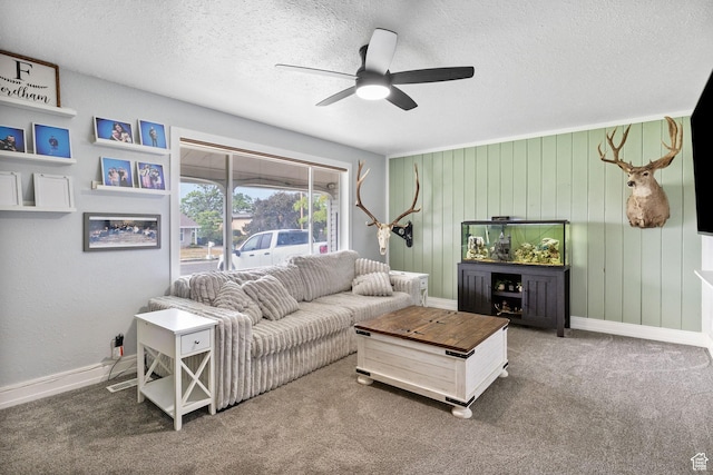 4895 W Pavant Ave, West Valley City, UT 84120 - living area with a textured ceiling, a ceiling fan, carpet floors, and wood walls