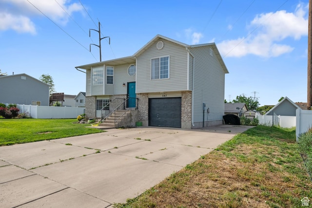 387 W 1900 S, Clearfield, UT 84015 - split foyer home featuring driveway, an attached garage, and brick siding
