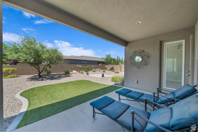 424 N Highland Pkwy, Washington, UT 84780 - fenced backyard with a patio area and an outdoor living space