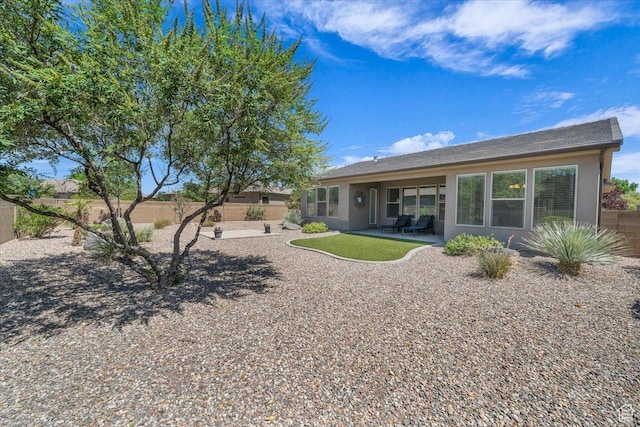 424 N Highland Pkwy, Washington, UT 84780 - rear view of house featuring stucco siding, a patio area, and a fenced backyard