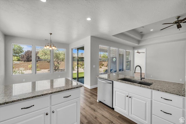424 N Highland Pkwy, Washington, UT 84780 - kitchen featuring dishwasher, light wood-style floors, a textured ceiling, a chandelier, and a ceiling fan