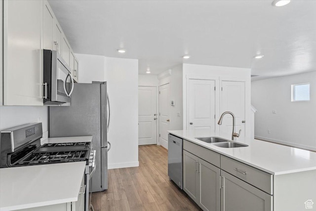 1734 E Muss Dr, Eagle Mountain, UT 84005 - kitchen featuring appliances with stainless steel finishes, light wood finished floors, light countertops, recessed lighting, and gray cabinets