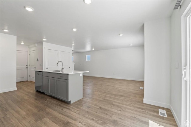 1734 E Muss Dr, Eagle Mountain, UT 84005 - kitchen featuring stainless steel dishwasher, light wood finished floors, gray cabinetry, light countertops, and recessed lighting