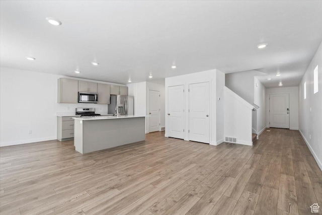 1734 E Muss Dr, Eagle Mountain, UT 84005 - kitchen with appliances with stainless steel finishes, gray cabinetry, recessed lighting, light wood-type flooring, and open floor plan
