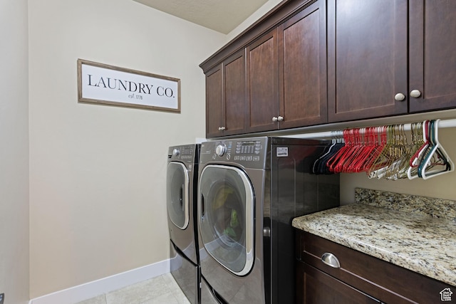 6923 W Long Ridge Dr S, Herriman, UT 84096 - laundry area with cabinet space, washer and dryer, and light tile patterned floors