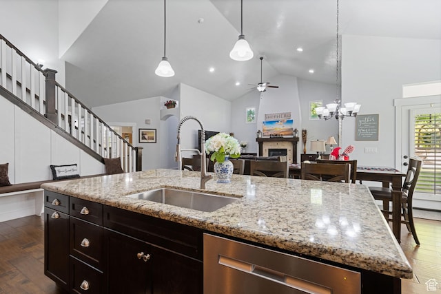 6923 W Long Ridge Dr S, Herriman, UT 84096 - kitchen with a fireplace, ceiling fan, dishwasher, dark wood finished floors, and open floor plan