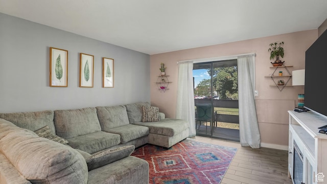 5667 S Aspen Ct E, South Ogden, UT 84403 - living room with wood finished floors and baseboards