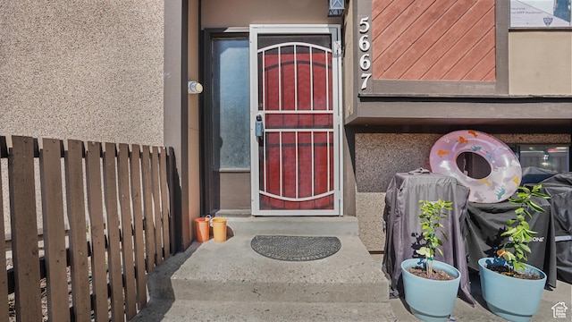 5667 S Aspen Ct E, South Ogden, UT 84403 - property entrance with stucco siding