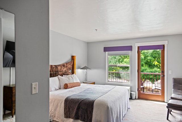 212 100 W 200 S Unit 212, Moab, UT 84532 - bedroom featuring access to outside and light colored carpet