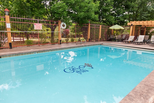 212 100 W 200 S Unit 212, Moab, UT 84532 - community pool with view of scattered trees and a pergola