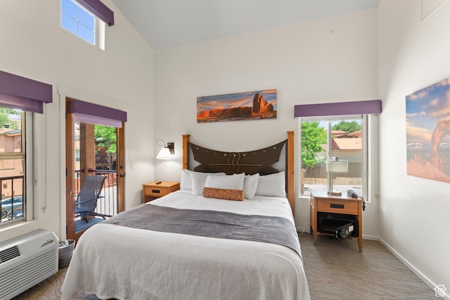 212 100 W 200 S Unit 212, Moab, UT 84532 - bedroom with a high ceiling, access to exterior, multiple windows, and an AC wall unit
