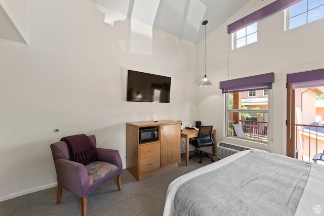212 100 W 200 S Unit 212, Moab, UT 84532 - carpeted bedroom with high vaulted ceiling, a desk, and an AC wall unit