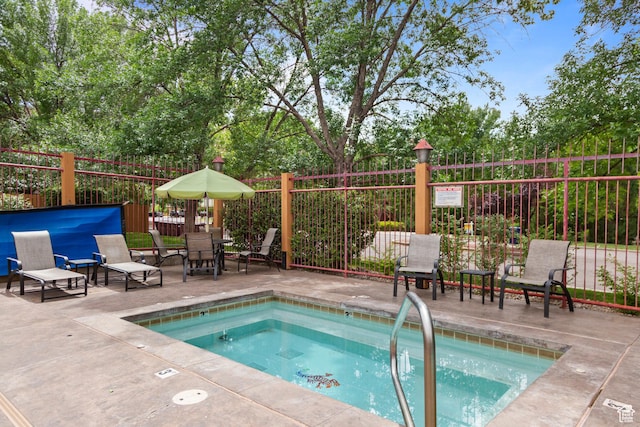 212 100 W 200 S Unit 212, Moab, UT 84532 - view of pool with a community hot tub, a patio, and a swimming pool