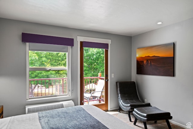 212 100 W 200 S Unit 212, Moab, UT 84532 - bedroom with radiator heating unit, access to exterior, and multiple windows