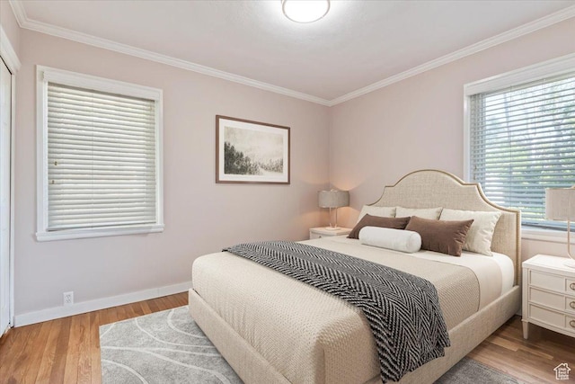 2009 E Hollywood Ave, Salt Lake City, UT 84108 - bedroom featuring multiple windows, crown molding, and wood finished floors