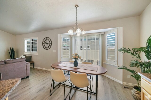 2051 E 1180 S, Spanish Fork, UT 84660 - dining room featuring a chandelier and light wood-style floors