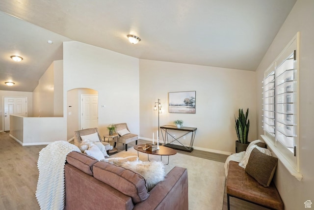 2051 E 1180 S, Spanish Fork, UT 84660 - living area with lofted ceiling, light wood-type flooring, and arched walkways