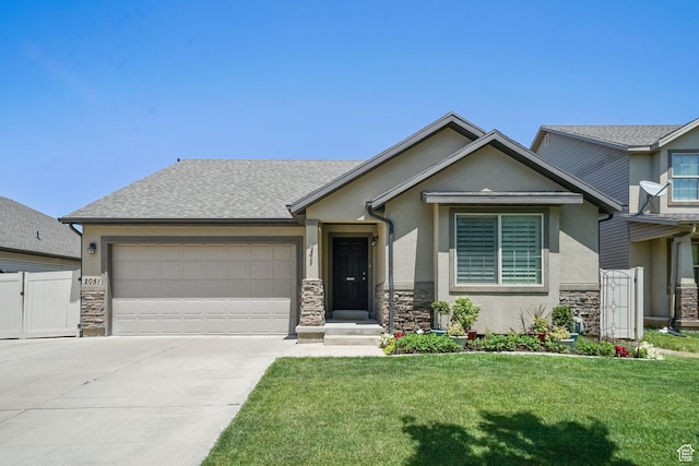 2051 E 1180 S, Spanish Fork, UT 84660 - view of front of house with stone siding, stucco siding, an attached garage, and driveway