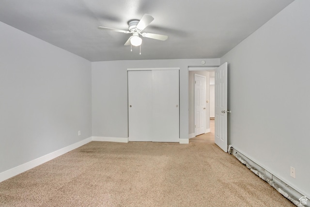 641 E Swenson Ave Unit 1, Springville, UT 84663 - unfurnished bedroom with light colored carpet, a closet, a ceiling fan, and a baseboard radiator