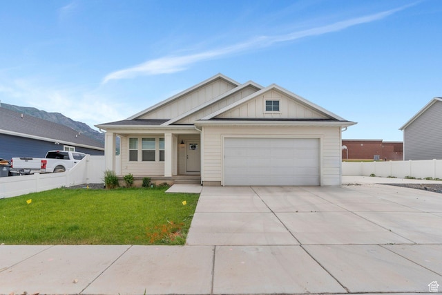 128 E 840 N, Santaquin, UT 84655 - view of front of house featuring board and batten siding, concrete driveway, and a garage