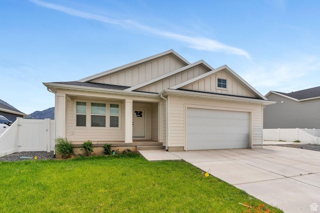 128 E 840 N, Santaquin, UT 84655 - view of front of property with board and batten siding, concrete driveway, an attached garage, a porch, and a gate