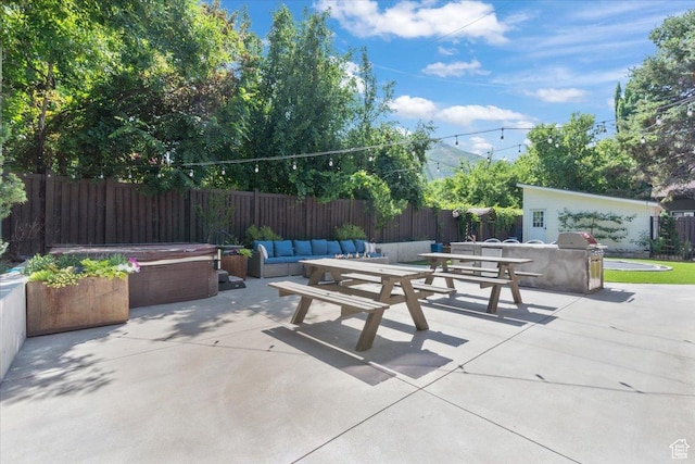 2494 E Murray Holladay Rd S, Holladay, UT 84117 - fenced backyard with a hot tub, a patio area, a grill, and outdoor lounge area