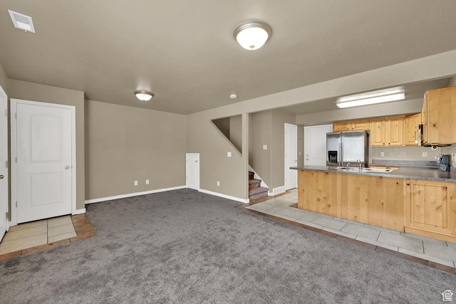 419 E 475 N, Ogden, UT 84404 - kitchen featuring stainless steel fridge, carpet, a peninsula, light brown cabinetry, and dark countertops