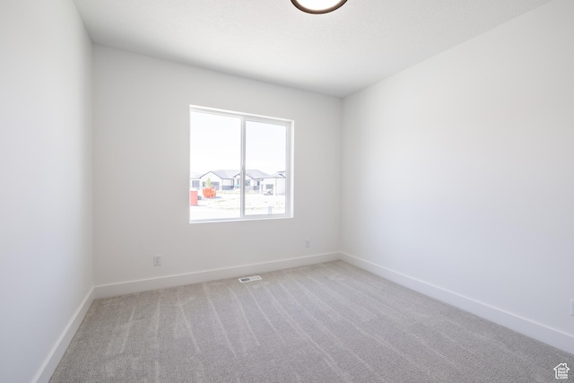 335 E Ventura Blvd, Stansbury Park, UT 84074 - unfurnished room featuring light carpet and baseboards