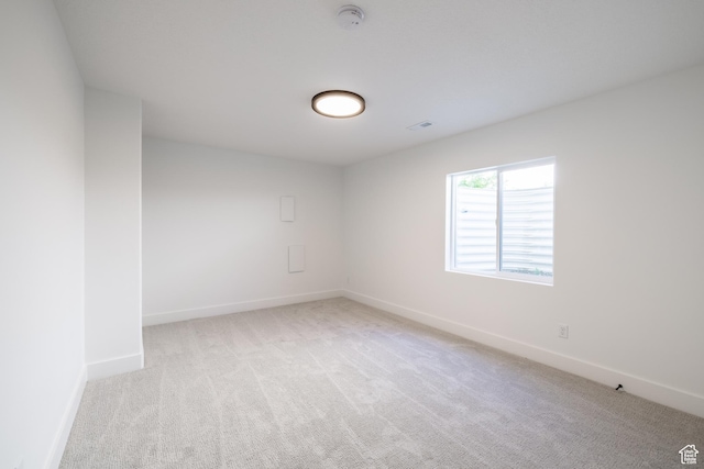 335 E Ventura Blvd, Stansbury Park, UT 84074 - empty room featuring light carpet and a smoke detector