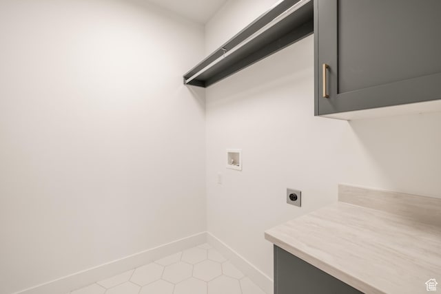 335 E Ventura Blvd, Stansbury Park, UT 84074 - washroom with hookup for an electric dryer, hookup for a washing machine, cabinet space, and light tile patterned floors