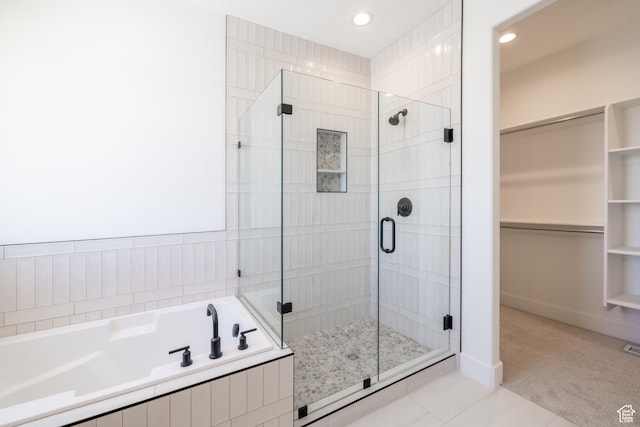 335 E Ventura Blvd, Stansbury Park, UT 84074 - full bath with a stall shower, a garden tub, a spacious closet, recessed lighting, and tile patterned floors