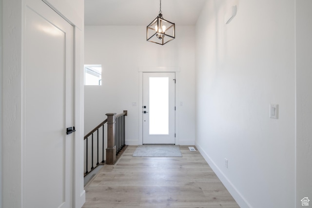 335 E Ventura Blvd, Stansbury Park, UT 84074 - entryway featuring a chandelier and light wood-style flooring