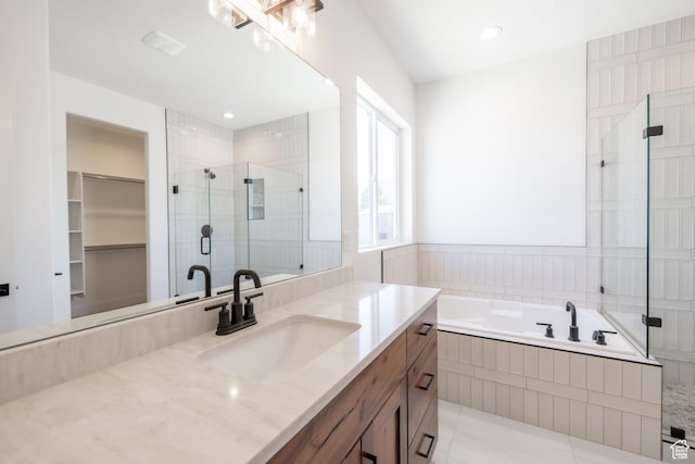 335 E Ventura Blvd, Stansbury Park, UT 84074 - bathroom with vanity, a shower stall, a garden tub, and tile patterned floors