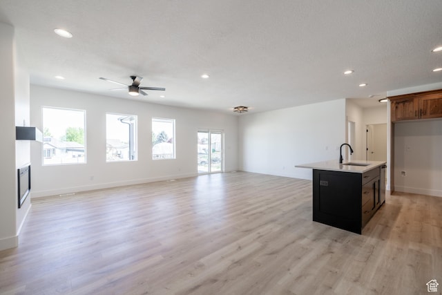 335 E Ventura Blvd, Stansbury Park, UT 84074 - unfurnished living room featuring recessed lighting, a ceiling fan, light wood-type flooring, and a fireplace