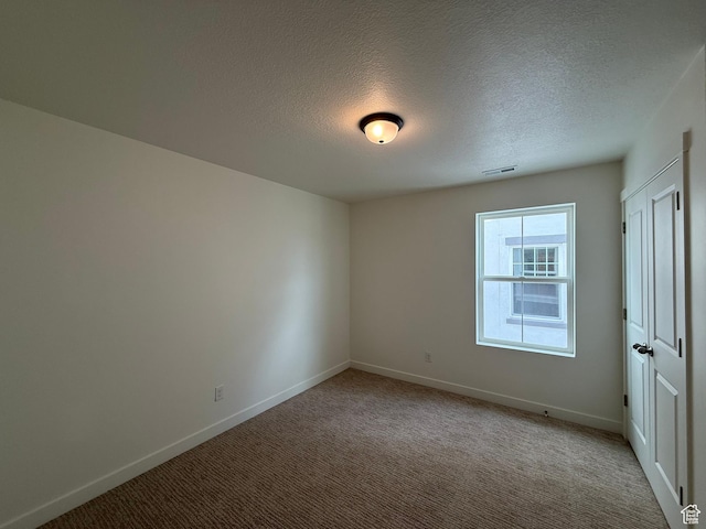 6927 W S Jordan Pkwy, South Jordan, UT 84009 - spare room featuring carpet and a textured ceiling