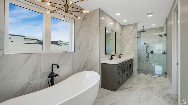 7233 W Summit Top Ln, Herriman, UT 84096 - bathroom featuring a stall shower, a freestanding bath, double vanity, tile walls, and marble tiled flooring