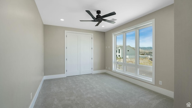 7233 W Summit Top Ln, Herriman, UT 84096 - unfurnished bedroom with carpet flooring, recessed lighting, a closet, and ceiling fan
