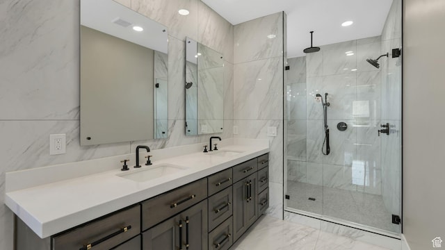 7233 W Summit Top Ln, Herriman, UT 84096 - full bathroom featuring marble look tiles, double vanity, a marble finish shower, and tile walls