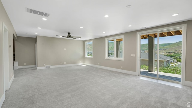 7233 W Summit Top Ln, Herriman, UT 84096 - spare room with light carpet, recessed lighting, and ceiling fan