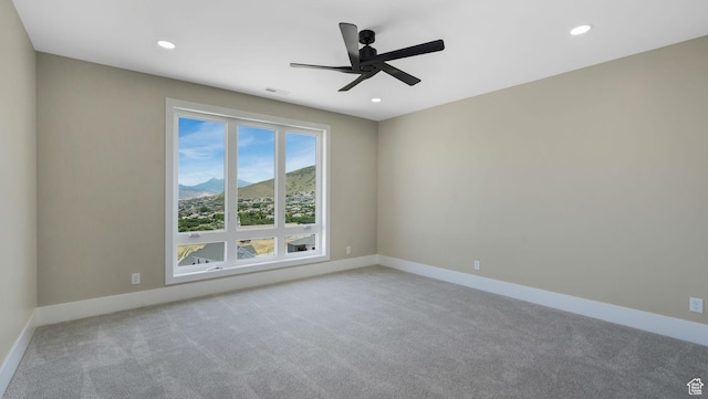 7233 W Summit Top Ln, Herriman, UT 84096 - carpeted spare room with a ceiling fan, recessed lighting, and a mountain view